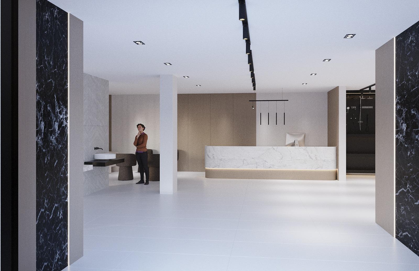 Showroom reception with a marble desk on a lit plinth, black marble piers and a shower display wall beyond