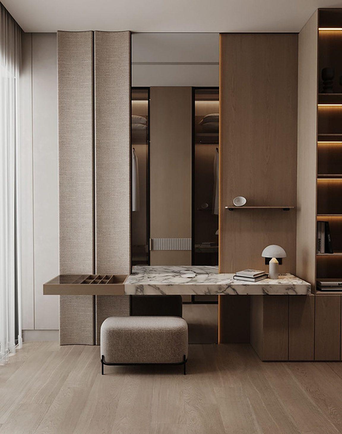 Dressing nook with a marble top vanity and integrated lighting